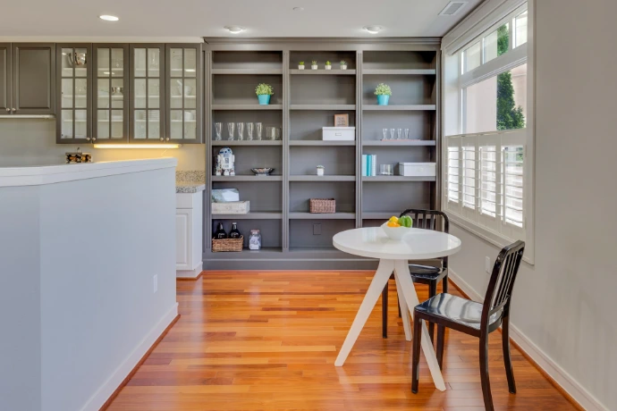 interior build-out with custom built-in shelving, cabinet, painting, lighting, and flooring