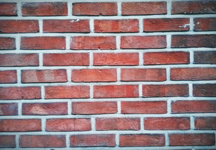 A close up of a red brick wall
