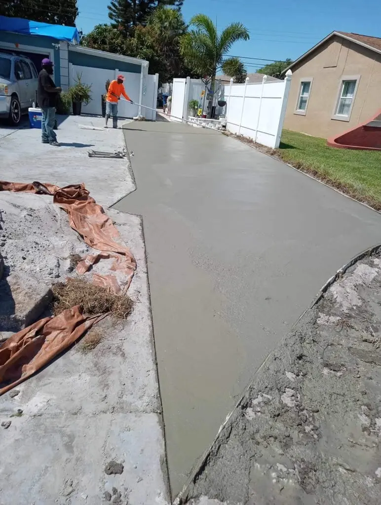 Concrete driveway extension being poured for a residential property