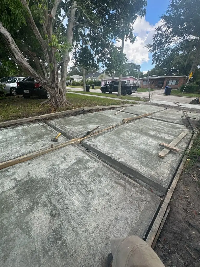 Residential concrete driveway replacement with new slab forms and fresh concrete