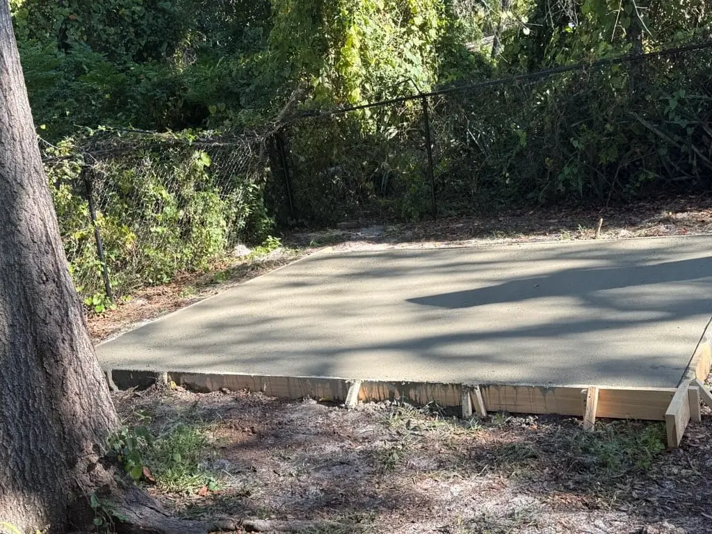 New backyard concrete slab installed for a residential property