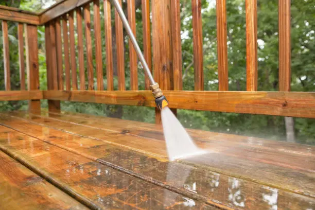 wooden deck getting power washed